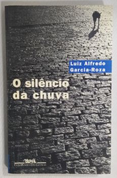 <a href="https://www.touchelivros.com.br/livro/o-silencio-da-chuva/">O Silêncio Da Chuva - Luiz Alfredo Garcia-Roza</a>